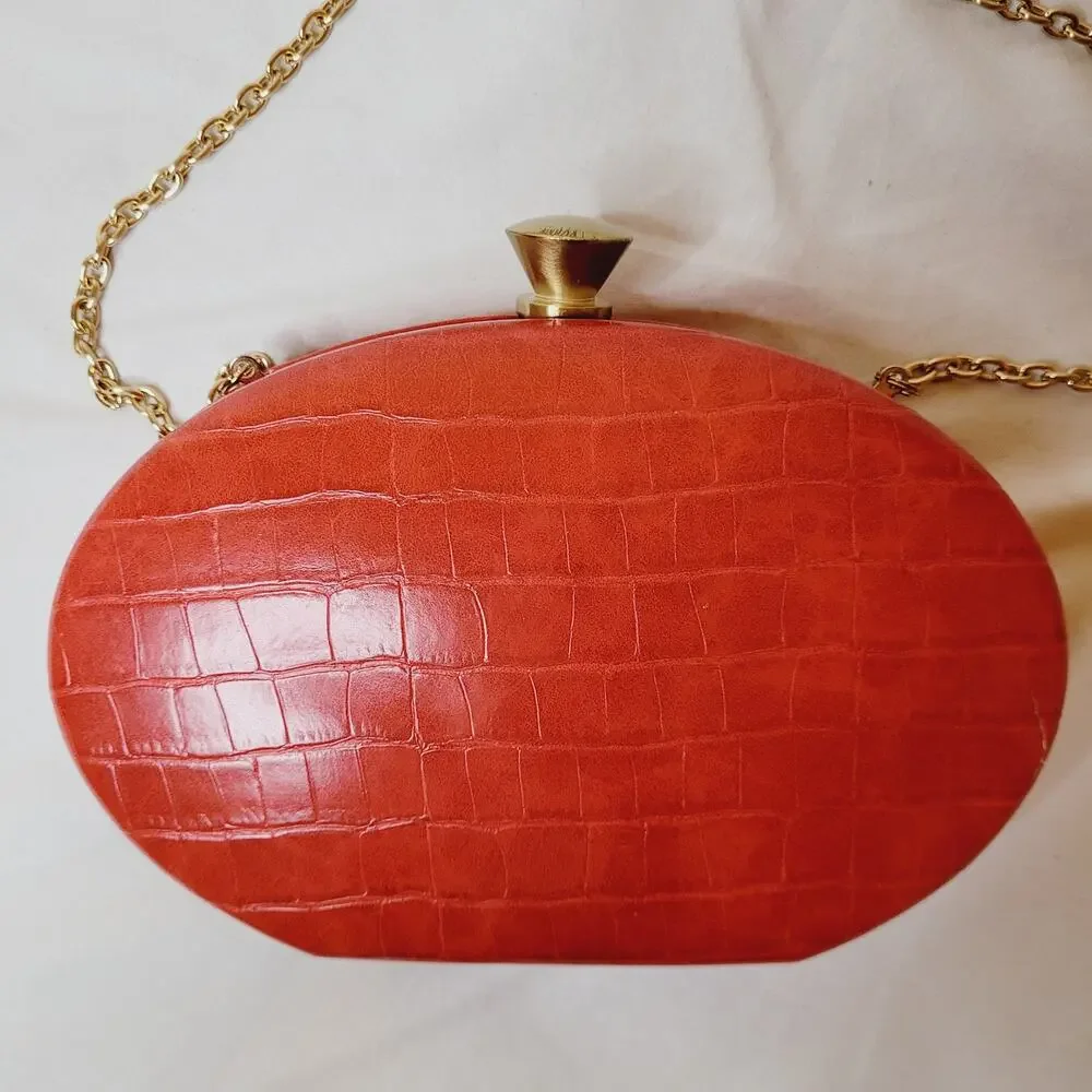Sondra Roberts red croc embossed leather oval hard case cross body bag